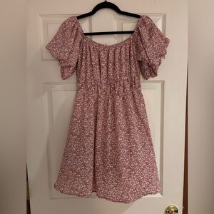Woman’s small pink floral dress
